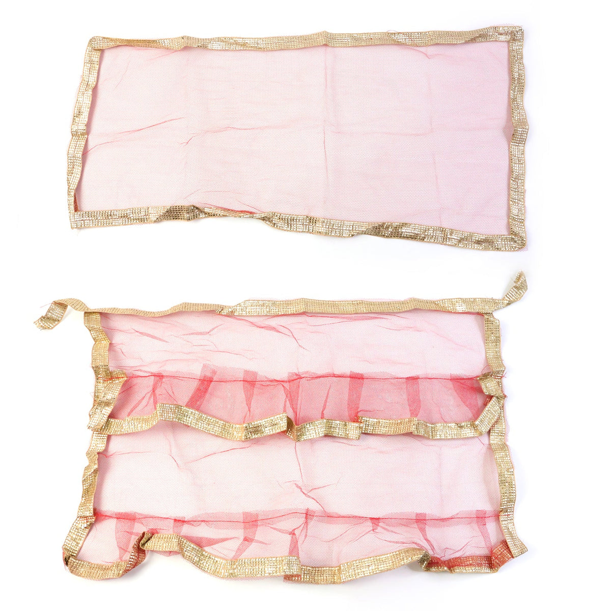 Red pooja cloth with gold border wound as net wrap for tulsi plant adorning