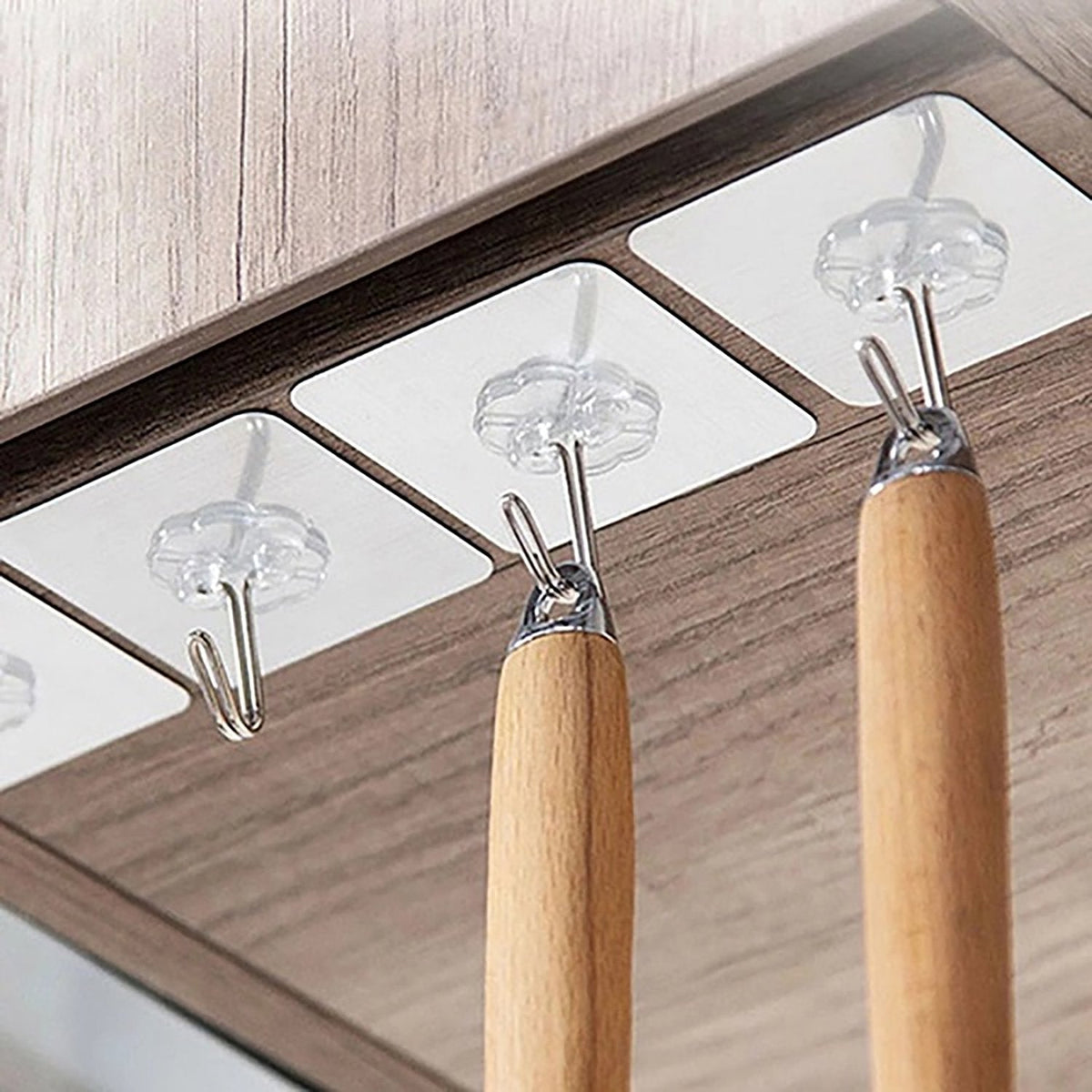 Versatile stainless steel adhesive hooks perfect for home and kitchen use.